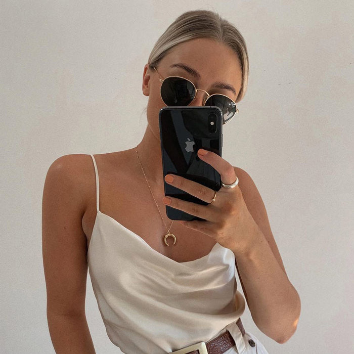 Mirror selfie with rings and necklaces