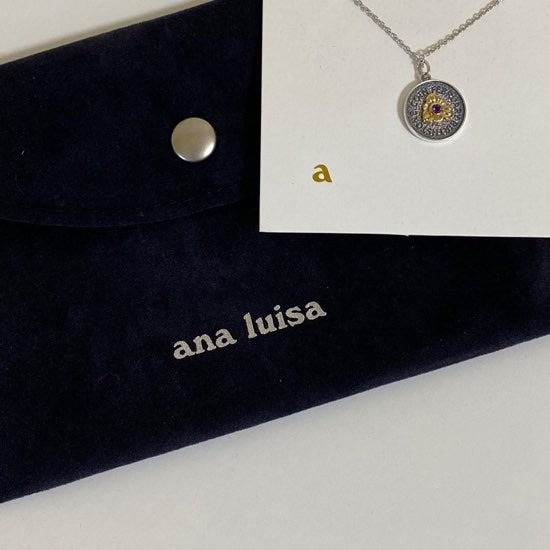 Noa ring next to necklace set