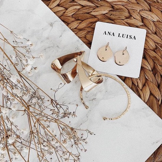 Gold earrings with thank-you note