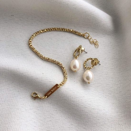 Pearl earrings next to Mini Kinoko Marble Blue earrings